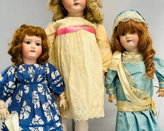 Vintage 22" MB Morimura Brothers doll, bisque head, blue sleep eyes, composition body, made in Japan; maker's mark on back along with "8"; a Heinrich Handwerck Simon & Halbig bisque head doll, made in Germany; wearing a light blue dress with lace sash and matching hat; and a 31" Simon & Halbig bisque head doll wearing a cream-color dress and matching hat, with stockings and shoes. Marked to the back with a star of David between K and R, Simon & Halbig.