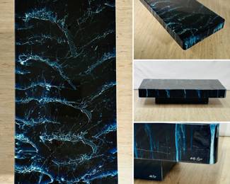 A signed Willy Rizzo (1928–2013) lacquered coffee table circa 1970s. A renowned photographer and furniture designer, Rizzo designed sleek, minimalist furniture, heavily influenced by Le Corbusier; clients included Salvador Dali and Brigitte Bardot. The table measures 55" L x 27" D x 12" H.