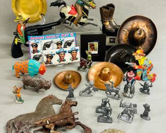 Vintage Western and Native American themed toys and miniatures including vintage tin Lone Ranger and six-shooter pistol "Badge Mount Set" collectible pins, a vintage tin litho clicker Shooting Cowboy toy, several vintage lead or pewter toy figures depicting Native Americans and a cowboy on horseback, a small cast metal pair of cowboy boots, likely toothpick or match holder; a vintage tin litho bucking bronco and cowboy wind up toy, buffalo figurines, cowboy hats and more
