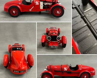 A vintage 1:18 scale diecast model of a 1934 Aston Martin Le Mans Roadster, number 96. 

