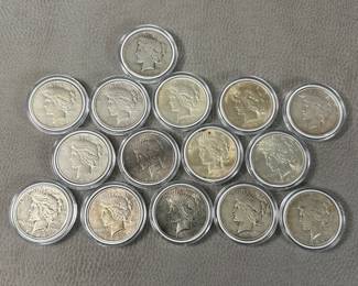 Fifteen US Peace Silver Dollars, mixed dates