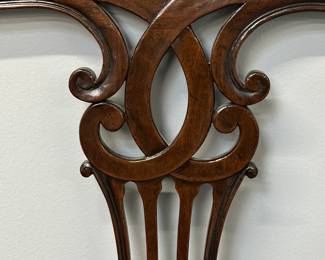 Closeup of pair of vintage 1940s/1950s mahogany Chippendale-style twin-size headboard and footboard.