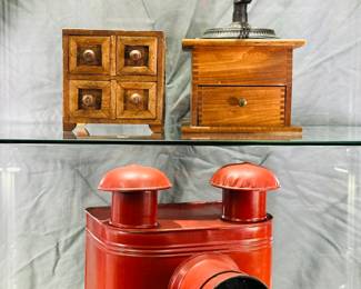 A vintage handmade primitive wood 4-drawer jewelry or spice apothecary cabinet, a vintage coffee mill grinder, and an antique red metal Mirrorscope magic lantern projector