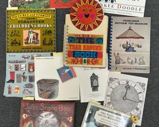 Books including the Molly Brett Picture Book, Pictures and Stories from Forgotten Children's Books, Julia Singing Bear, Perelman Antique Toy Museum, and John Brown, Rose and the Midnight Cat