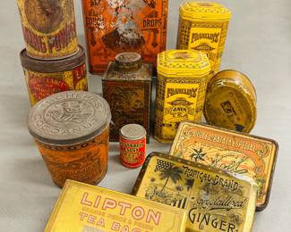 Vintage, replica and modern lidded tin canisters, boxes with advertising including Globe Baking Powder, Franklin's Famous Java Tea, a Schepp's cocoanut tin, Tropical Brand Best Crystalized Ginger,  Try Moses Cough Drop Tin,  W. E. Garrett & Sons Sweet Mild Snuff