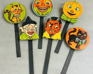 Vintage Halloween cardboard and wood noisemakers, also known as squeakers