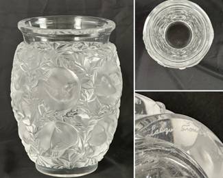 A Lalique "Bagatelle" frosted and clear crystal vase. The design, first introduced by René Lalique in 1939, features a repetitive motif of birds nestled among leafy branches. Signed Lalique France to the base.
