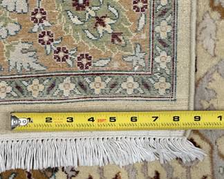 Another view of the A lovely Oushak area rug with a traditional Persian design and an ivory background, 49" x 71".