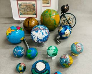 Globe toys, globe keychain, a globe clip-on ornament, a a Florida Marlins 1996 Earth Day Commemorative Baseball, a small walking globe windup toy