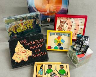 Vintage dexterity games, a Friendship Club Match Game, a 4 In 1 small wood puzzle with plastic case,  a vintage "The Greatest Show on Earth" game box by Saalfield