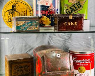 Vintage and replica canisters, lidded tins with advertising including Cracker Jack, Campbell Soup, Dr. Johnson's Educator Crackers, Punch polish mop advertising tin, Little Tom cigar tin or box, and more.