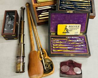 Two antique brass drawing instruments sets in wooden cases, a vintage Reeves Terrachrome Crayons tin, a vintage "The Hartford Tire Repair Kit" tin, produced by The Hartford Rubber Works Co.; an antique Chinese opium scale, also known as a dotchin, with its wooden case; an antique-style brass spyglass telescope, antique pince-nez with case
