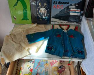 Vintage baby clothes and books 