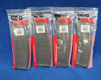 Lot 105. Four new ProMag AR-15/M16 42 round magazines