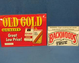 Lot 32. Two metal signs in good condition. An Old Gold 25.5" x 17.5" and a Backwoods 17" x 11".