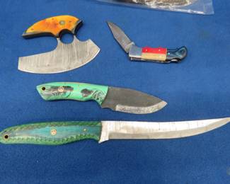 Lot 285. Five new knives with leather sheaths and no markings
