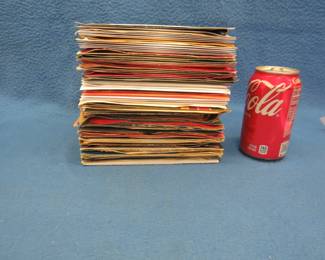 Lot 23. Over 75 45 RPM records. Some of the artists included are The Mamas and Papas, Alice Cooper, Moe Bandy, Ricky Nelson and many more.