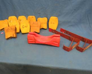 Lot 419. Ten ladder protectors, two roof brackets, and a ladder step