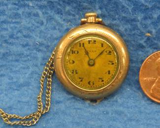 Lot 10. Vintage working 15-jewel Swiss made ladies' watch from the Sada Watch Co. 14 KT B & B Royal 20-year gold filled case. Case S/N 89294. Chain unmarked.