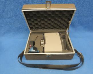 Lot 166. Vintage Polaroid 320 Automatic Land Camera in original case with flash attachment and manual