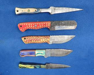 Lot 221. Five new knives with leather sheaths, four are Damascus, no markings
