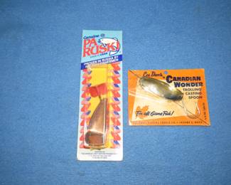 Lot 276. Two vintage NIP spoons: PA Ruski 3" spoon. Les Davis 3" Canadian Wonder.