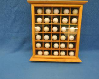 Lot 367. 30-place golf ball display cabinet with golf balls