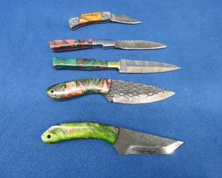 Lot 288. Five knives with leather sheaths and no markings