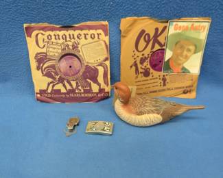 Lot 320. 1933 Mexican one peso coin money clip, two Gene Autry records, and a decorative duck