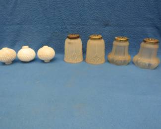 Lot 57. Two sets of matching glass lamp shades and three decorative globes for a lamp stand