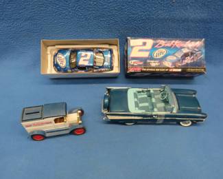 Lot 205. Three die-cast vehicles. One is in the original box. The other