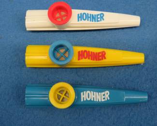 Lot 141. Three plastic Hohner kazoos