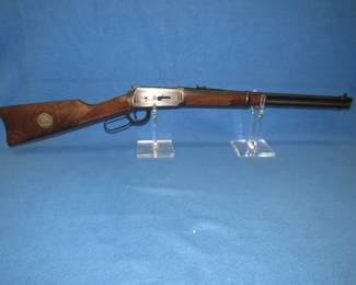 Lot 16. Never-fired 1972 Winchester Model 94 30-30 commemorative Wells Fargo edition lever-action rifle. Saddle ring carbine with the original box and sleeve.