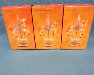 Lot 324. Three identical music boxes each playing a different tune.