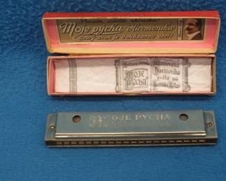 Lot 268. Rolz Moje Pycha (My Pride) 40-hole tremolo harmonica in the box in VGC. Sounds great. Minimum bid $45. harmonicas.