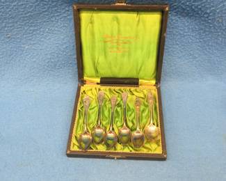 Lot 12. Three different sets of matching spoons. All have engraved names. Believed to be silver-plated. Display box from Sweden.