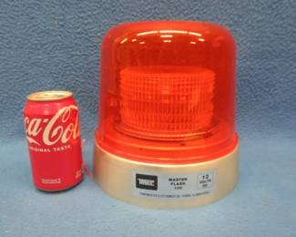 Lot 240. "Party on Garth" Tonemaster Electronics flashing amber light in good working condition. Original box and hardware.