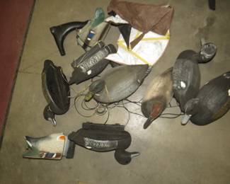 Lot 400. 7 resting and 2 feeding duck decoys