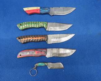 Lot 223. Five new Damascus knives with leather sheaths and no markings