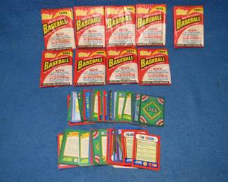 Lot 341. Nine packs of unopened 1991 baseball cards and early 1990s Score cards