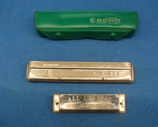 Lot 83. Hohner Echo #2409 tremolo harmonica. Some holes sound flat. Harmonic Reed Co. All-Star diatonic harmonica. Sounds great.