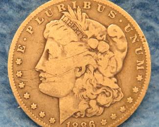 Lot 210. 1886 O Morgan Silver Dollar