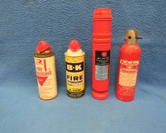 Lot 204. Four old fire extinguishers. All are full.