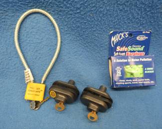 Lot 108. Three gun locks and earplugs