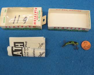 Lot 194. Helin 3/4" flyrod Flatfish in the box with papers and a National Expert Bait Co. (NEBCO) from Minneapolis 4 1/2" Musk-E-Flash