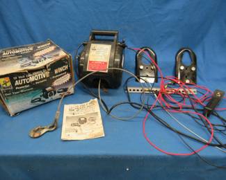 Lot 418. Travel-Pro 12-volt portable winch with mounting brackets, manual, and original box