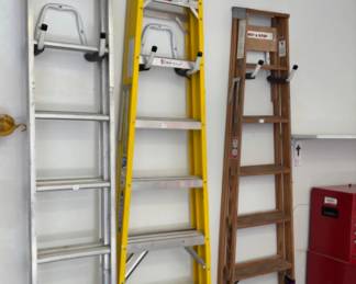 Three sizes of step ladders