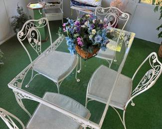Wrought Iron Glass top table and matching chairs 
