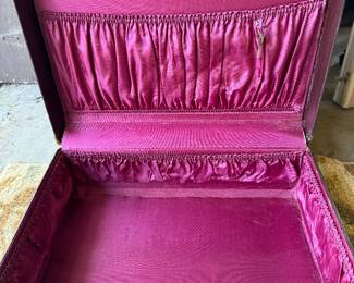 Old timey suitcase with satin interior and elasticized pockets