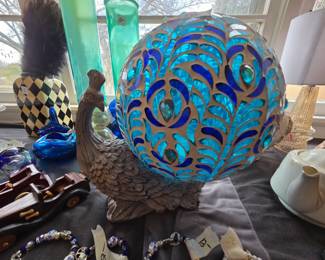 #48	Blue peacock sun globe 14" tall	 $20.00 
